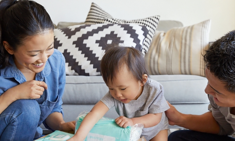 Mother, father and young child celebrating a new home